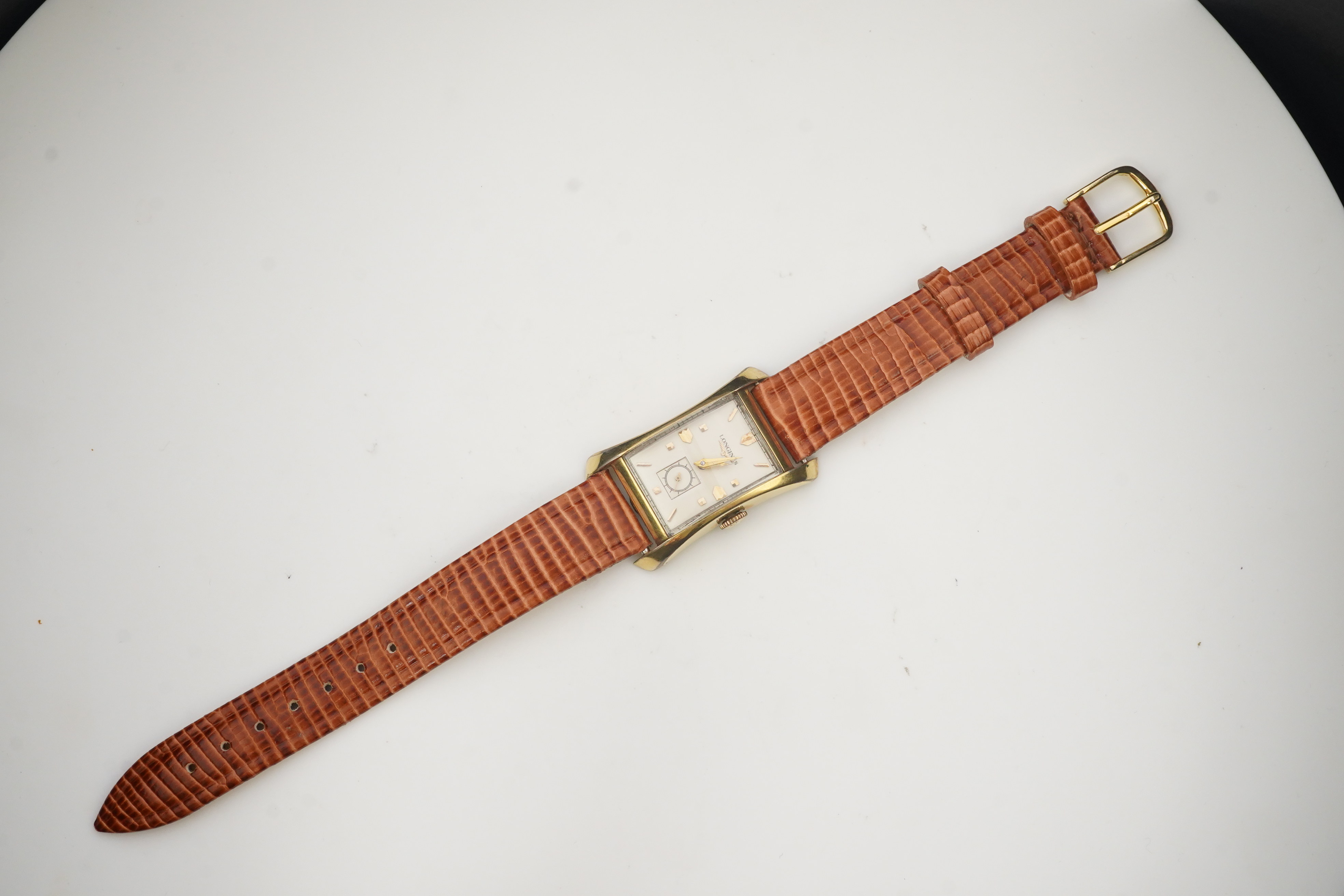 A gentleman's 1950's 10k gold filled Longines manual wind wrist watch, on a later associated leather strap